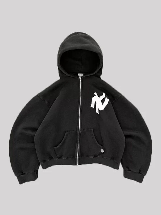 man wearing black hoodie with jeans casual street style