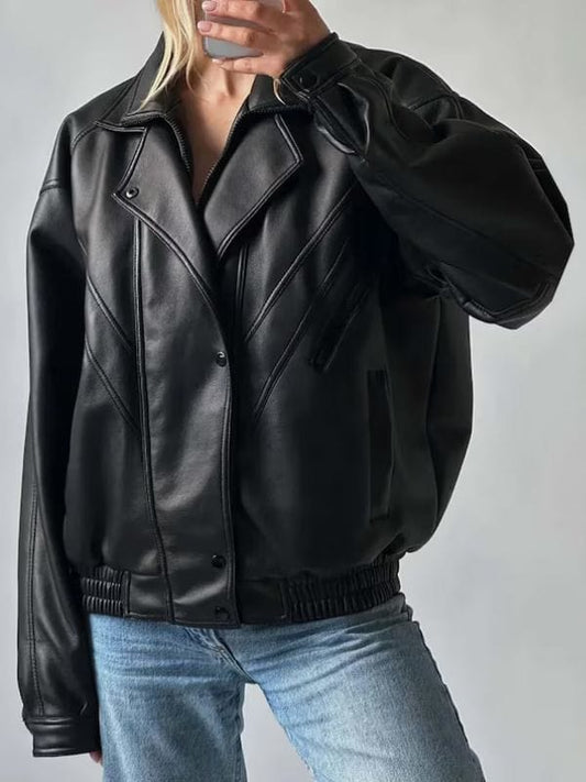 Women wearing black oversized leather bomber jacket – 90s vintage style