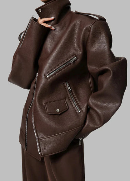 Brown leather jacket with zippers on a gray background