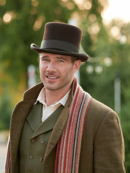 “Ryan Scott Wool Coat from A Magical Christmas Village – Mid-length winter coat with structured shoulders, cozy wool, and festive holiday style”