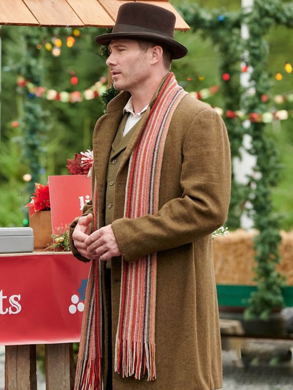 “Ryan Scott Wool Coat from A Magical Christmas Village – Mid-length winter coat with structured shoulders, cozy wool, and festive holiday style”