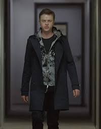 Dane DeHaan black wool coat inspired by The Stranger Series Carl E. character.