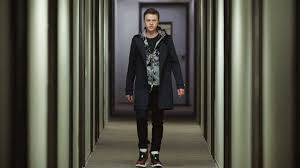Dane DeHaan black wool coat inspired by The Stranger Series Carl E. character.